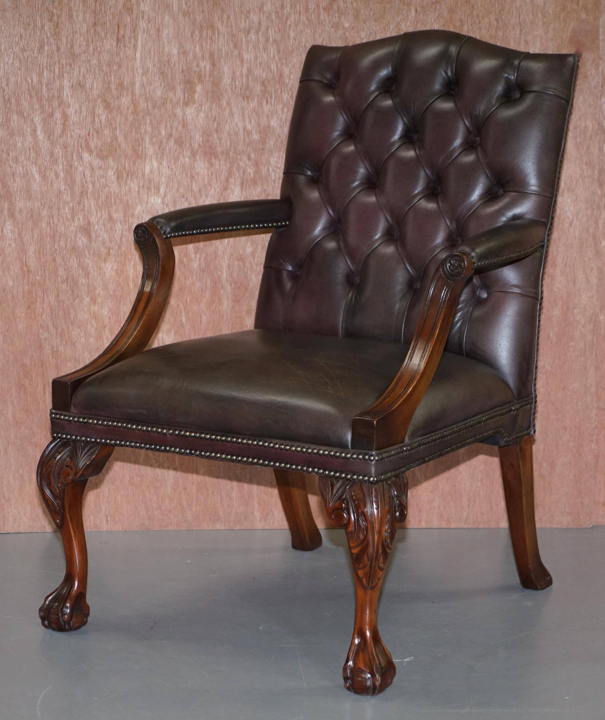 Gainsborough armchair George II leather Chesterfield hand-carved with claw and ball feet.