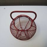 Old red-painted metal egg basket