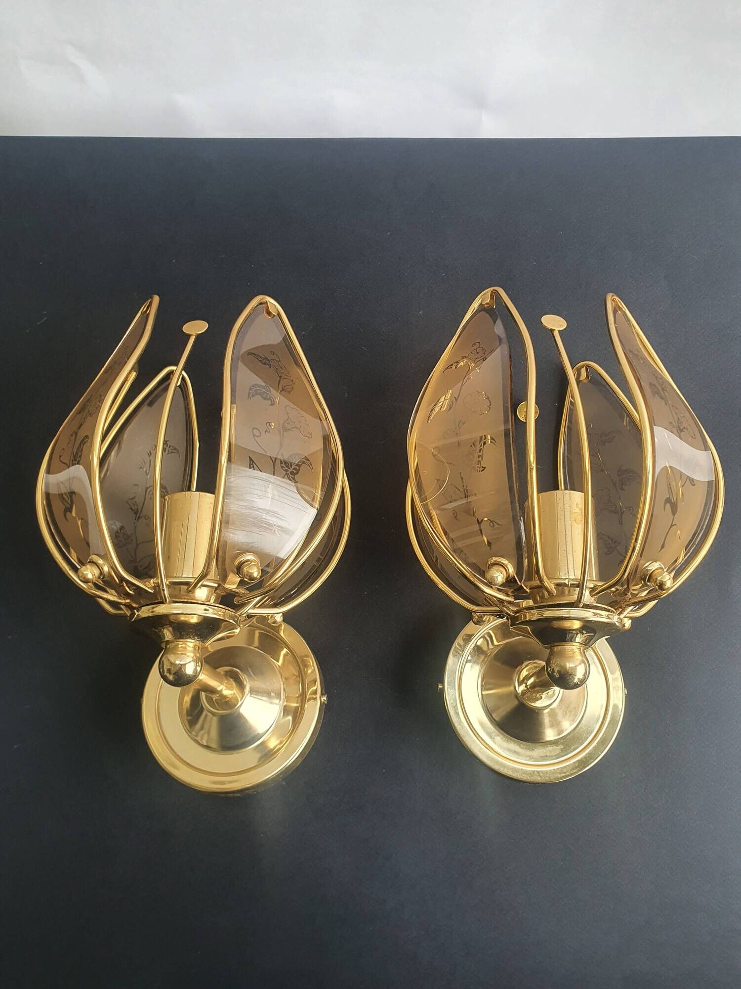 Pair of vintage brass wall sconces with glass shades