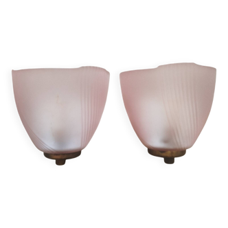 Art Deco wall lights with frosted pink glass and brass.