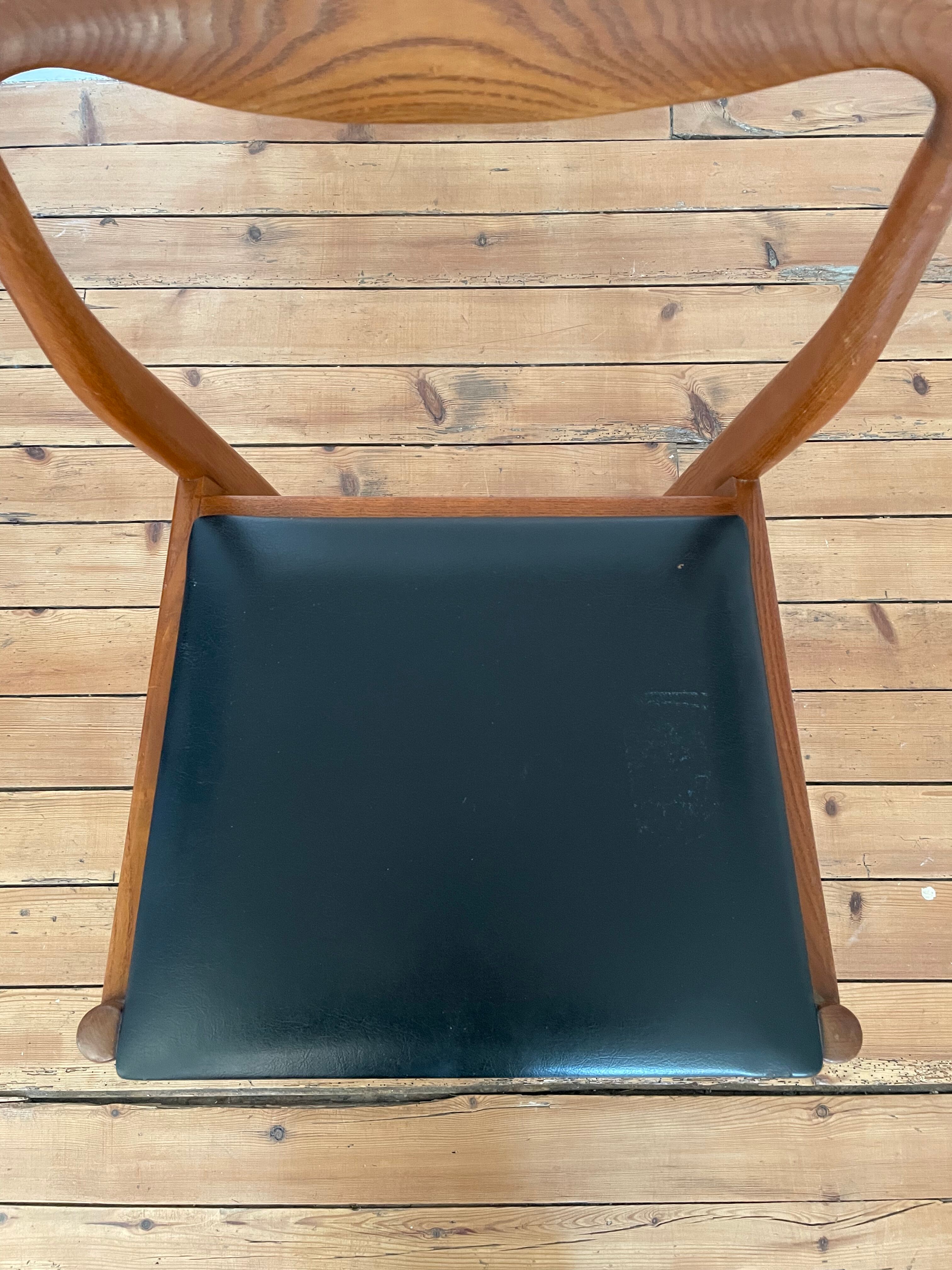 Pair of Scandinavian chairs in teak and skaï, 1965