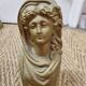 Cast iron andirons heads of women
