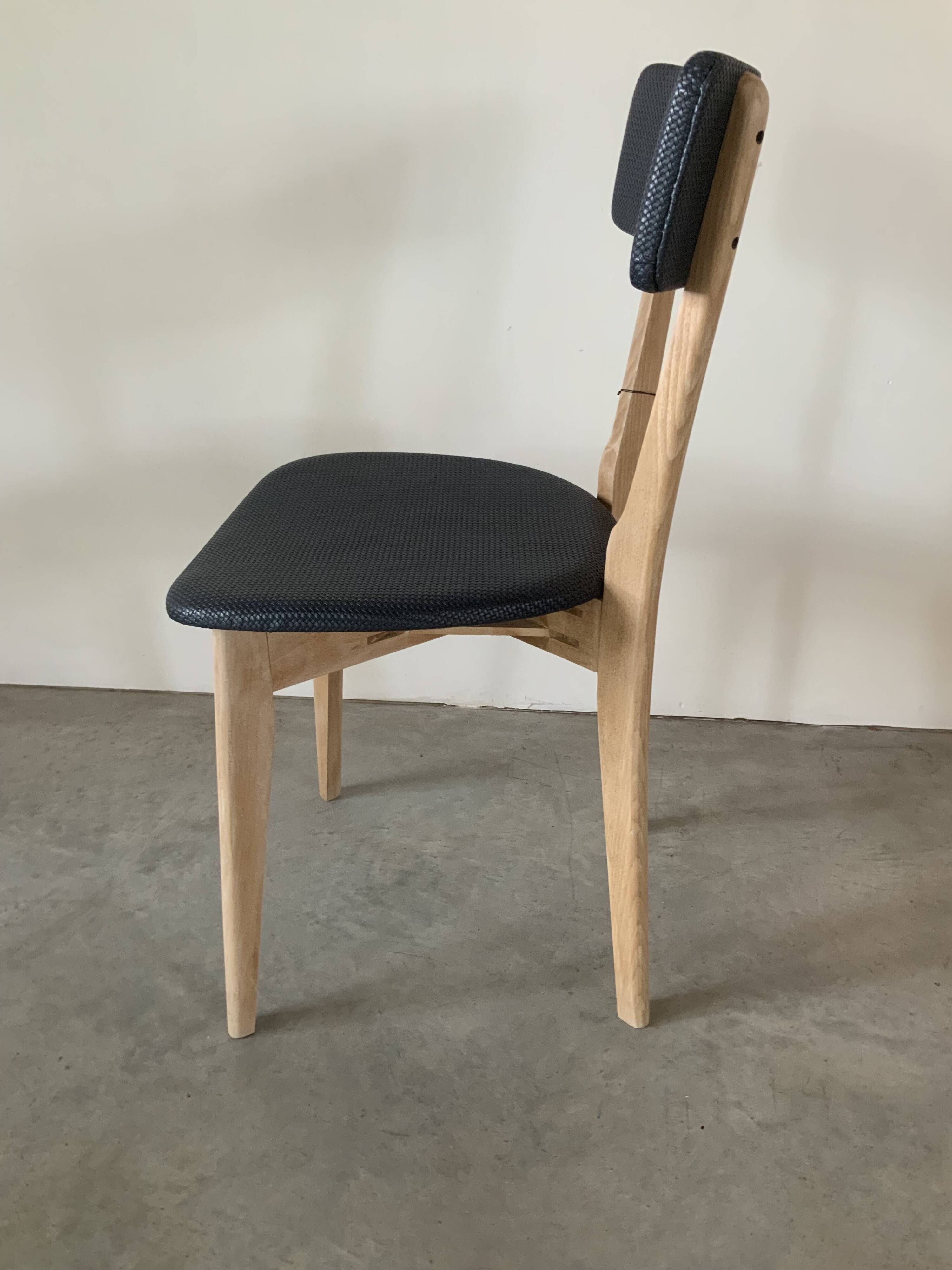 Restored vintage chair in midnight blue vinyl from the 50s