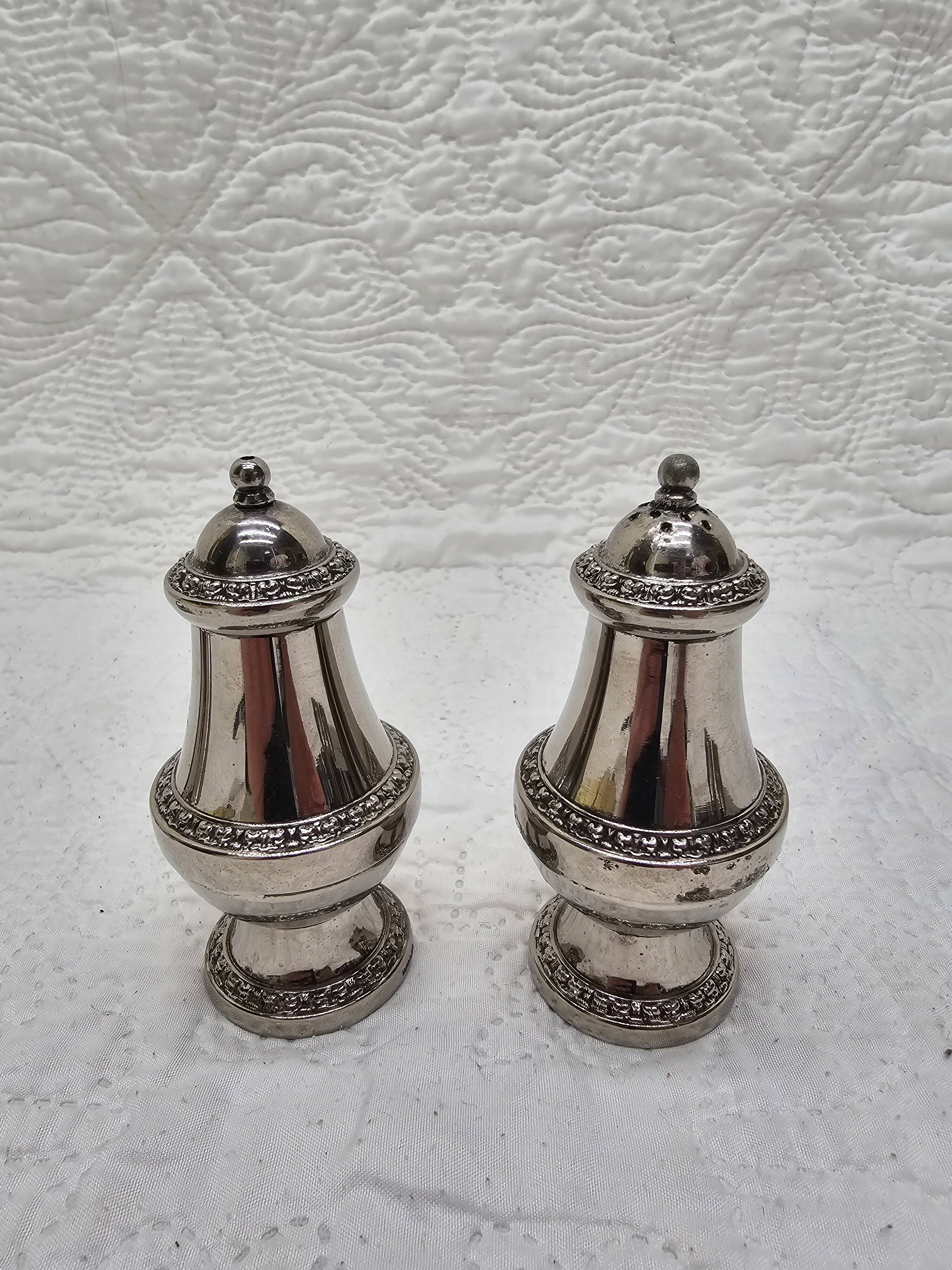 Silver-plated salt and pepper shakers and egg cups