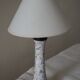 Table lamp for bedside use in earthenware with a wooden base.