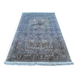 Hand-knotted Persian silk rug