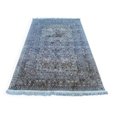 Hand-knotted Persian silk rug