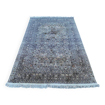 Hand-knotted Persian silk rug