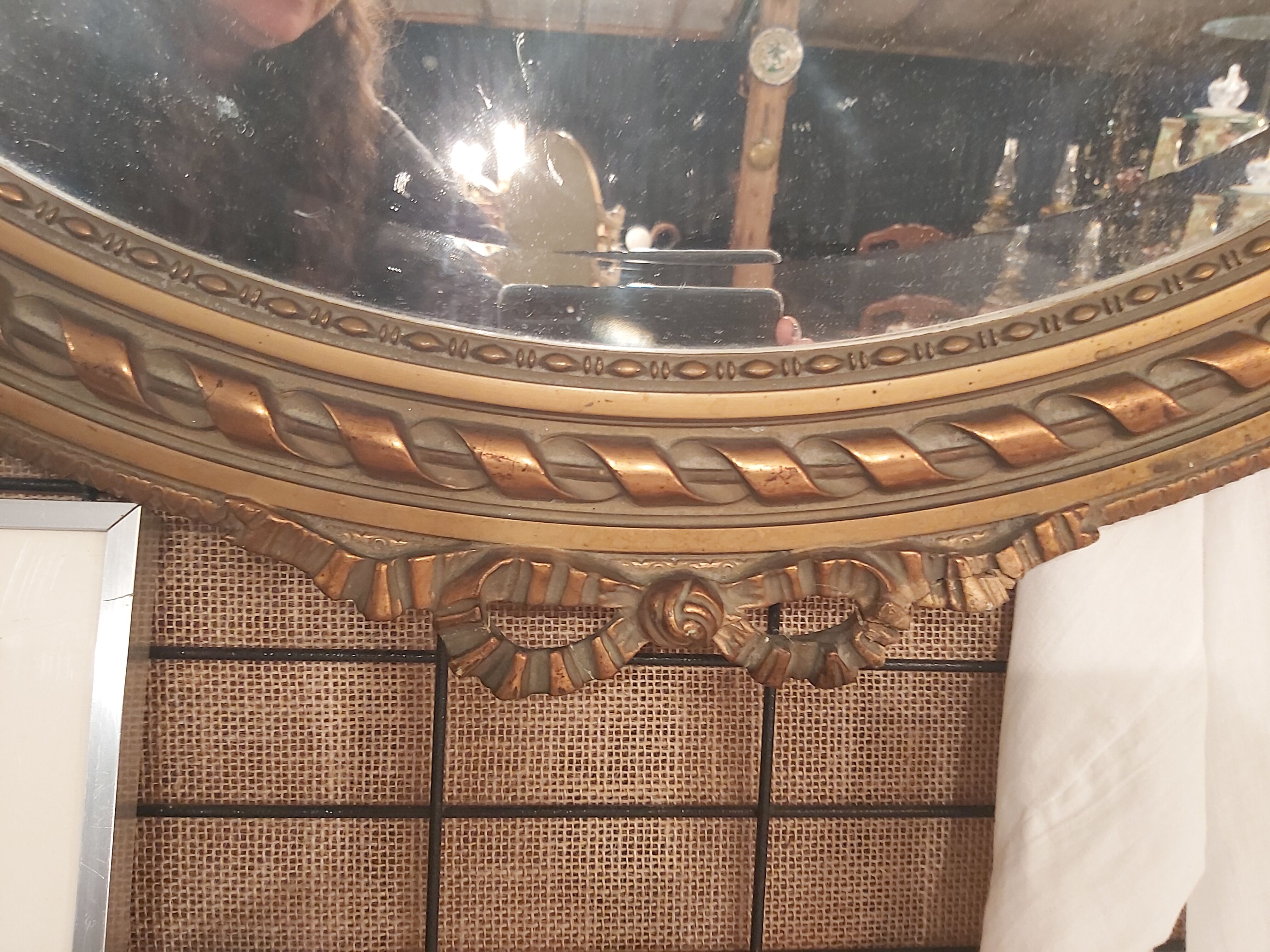 Louis XVI style oval beveled mirror