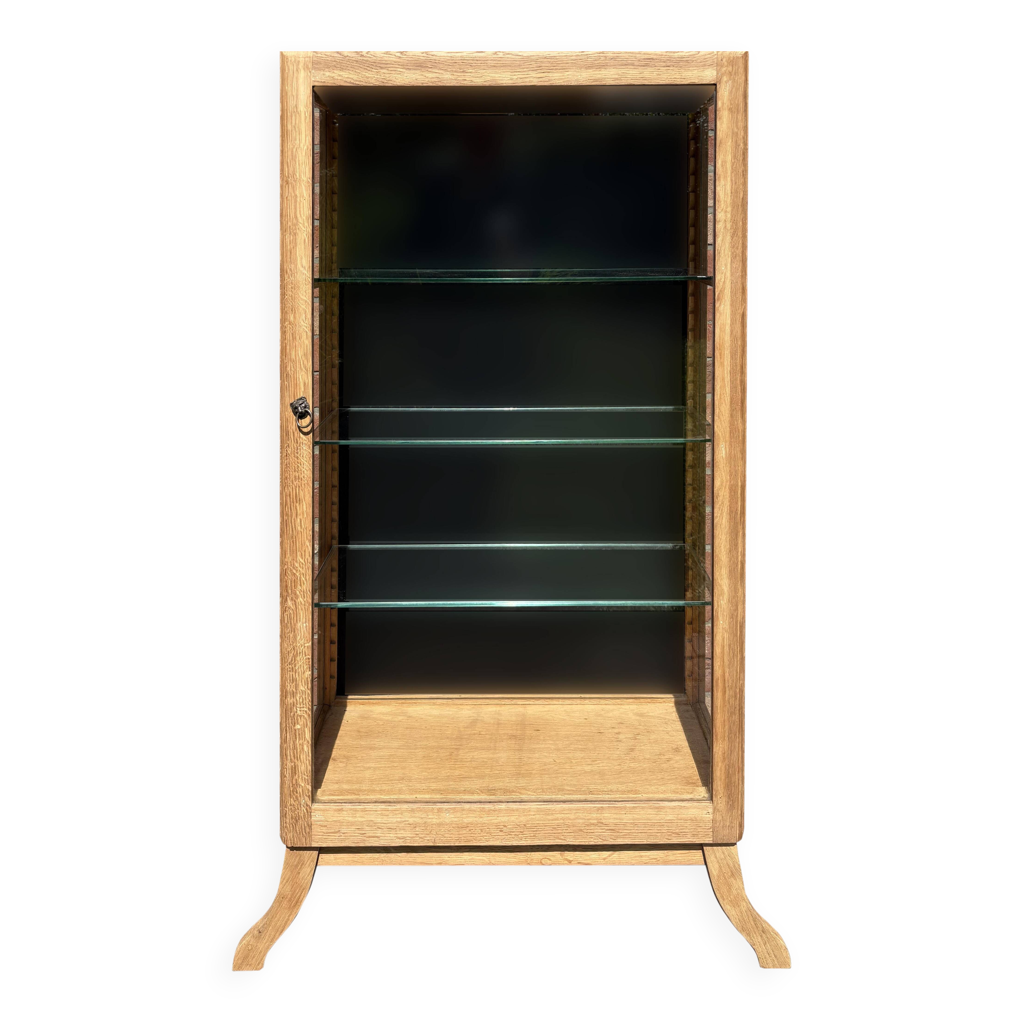 Restored antique oak display cabinet, black background, glass shelves.