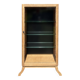Restored antique oak display cabinet, black background, glass shelves.