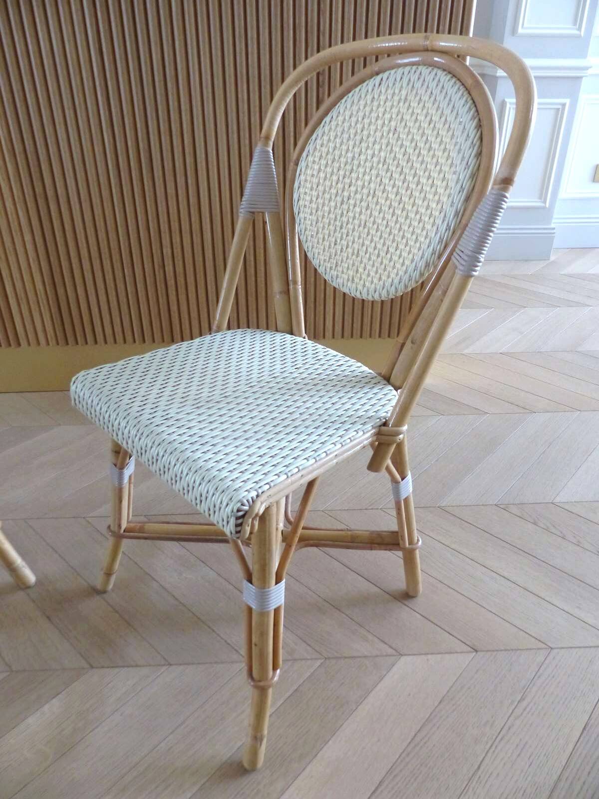 Pair of Parisian bistro chairs from Maison Louis Drucker in light Manila rattan.