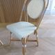 Pair of Parisian bistro chairs from Maison Louis Drucker in light Manila rattan.