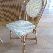 Pair of Parisian bistro chairs from Maison Louis Drucker in light Manila rattan.