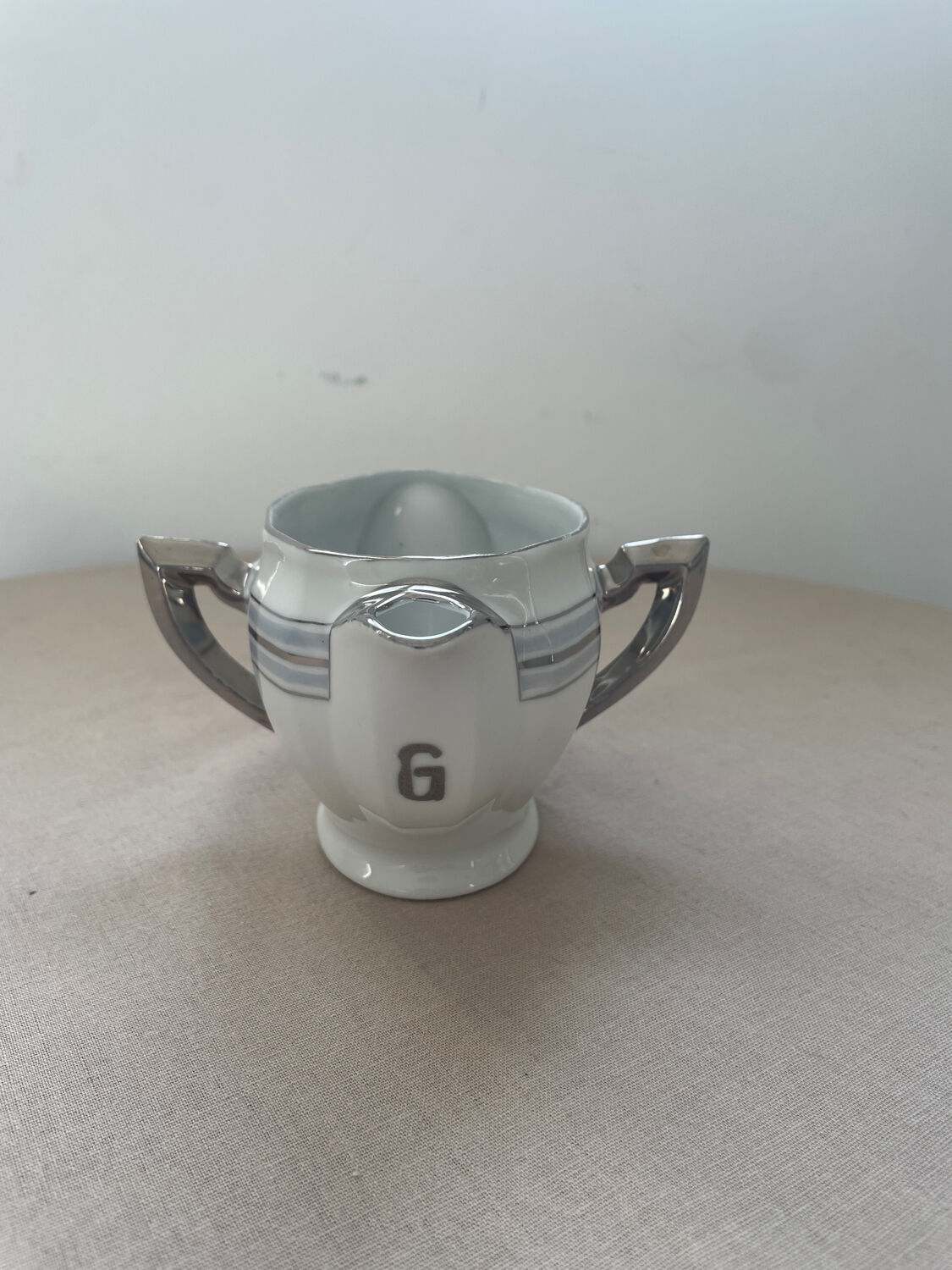 Antique white French porcelain sauce boat M&S with silver trim.