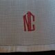 Set of ten antique cotton honeycomb towels hand-embroidered figure