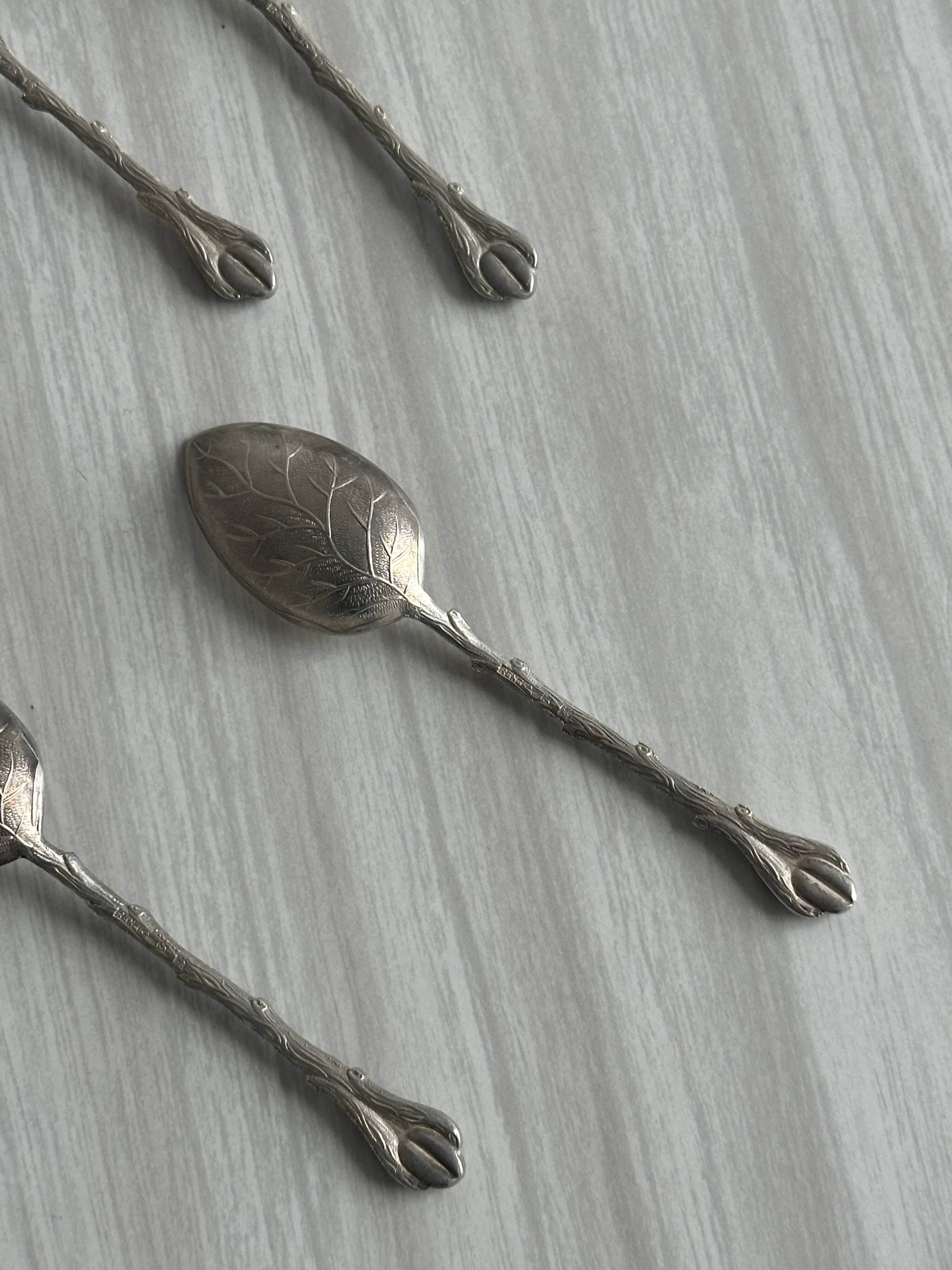 Set of 10 small silver metal spoons