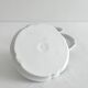 2 bougeoirs à main anciens en porcelaine blanche