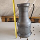 Large copper pitcher and old tin