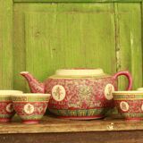 Chinese pink mu shou teapot and its cups