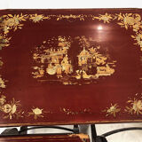 Series of three red lacquered nesting tables with gold decoration in Asian style, nineteenth