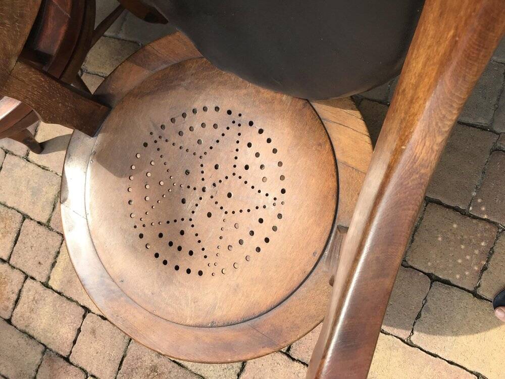 Pair of antique brown swivel armchairs in upholstery fabric, wooden frame, Hungary circa 1900.