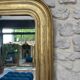 Antique mirror 86.5/69cm Louis-Philippe gilded with gold leaf, engraved decoration.