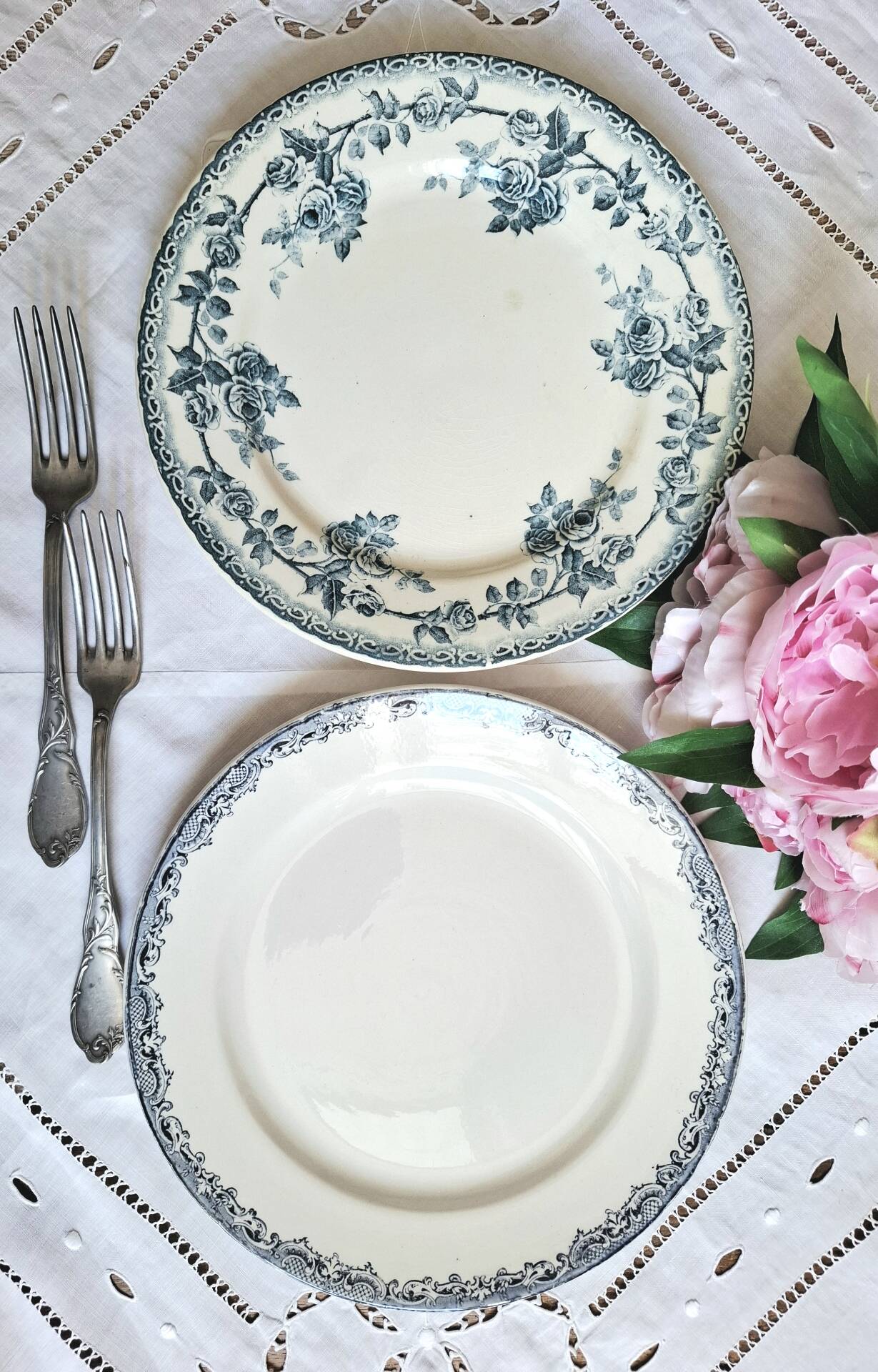 Old mismatched flat plates made of ironstone earthenware.