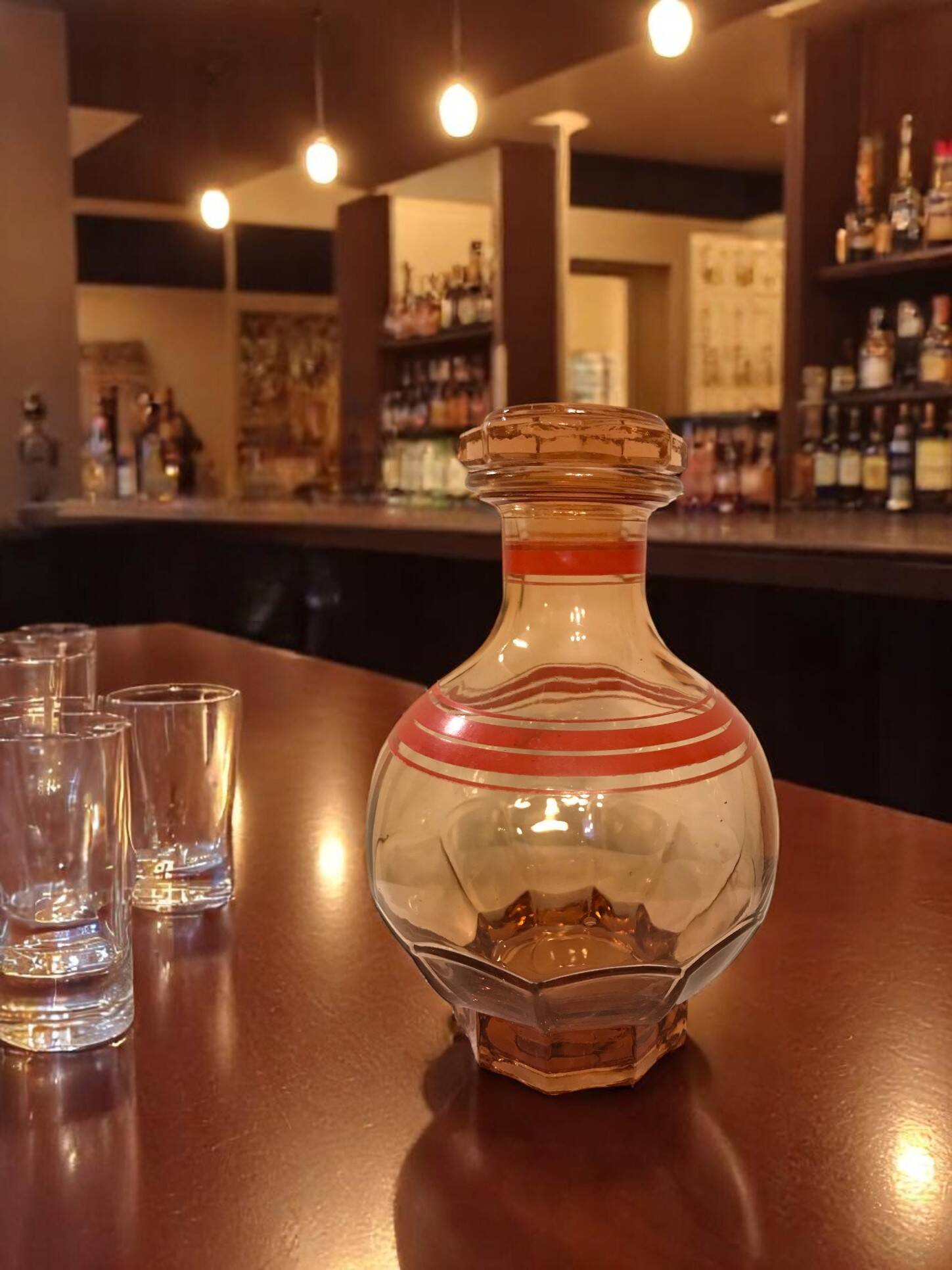 Art Deco, round smoked glass carafe with red edging circa 1930