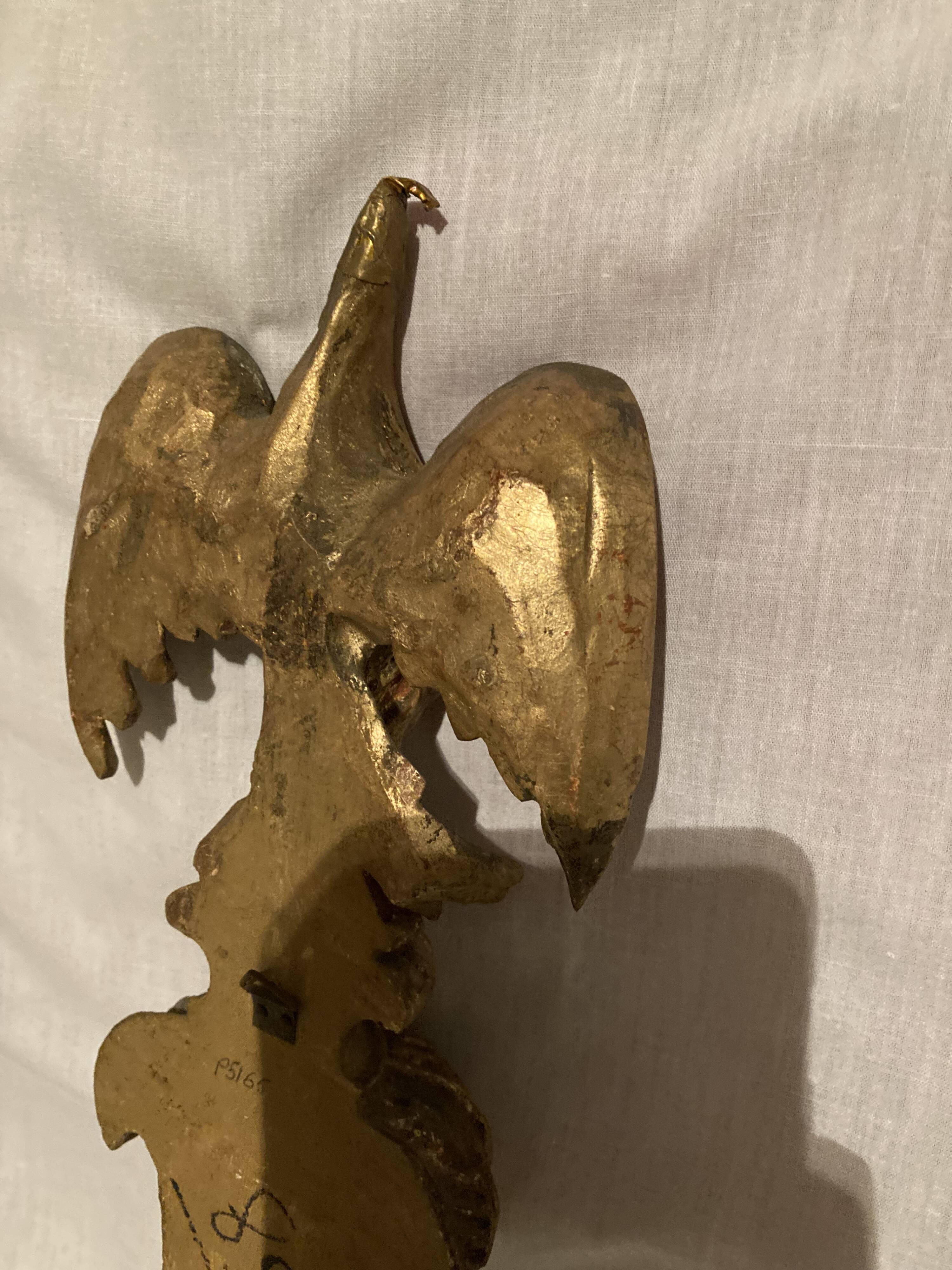 Pair of candle holders in wall, eagle pattern in gilded wood and brass