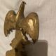Pair of candle holders in wall, eagle pattern in gilded wood and brass