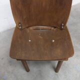Atypical 1960s curved wood children's chair