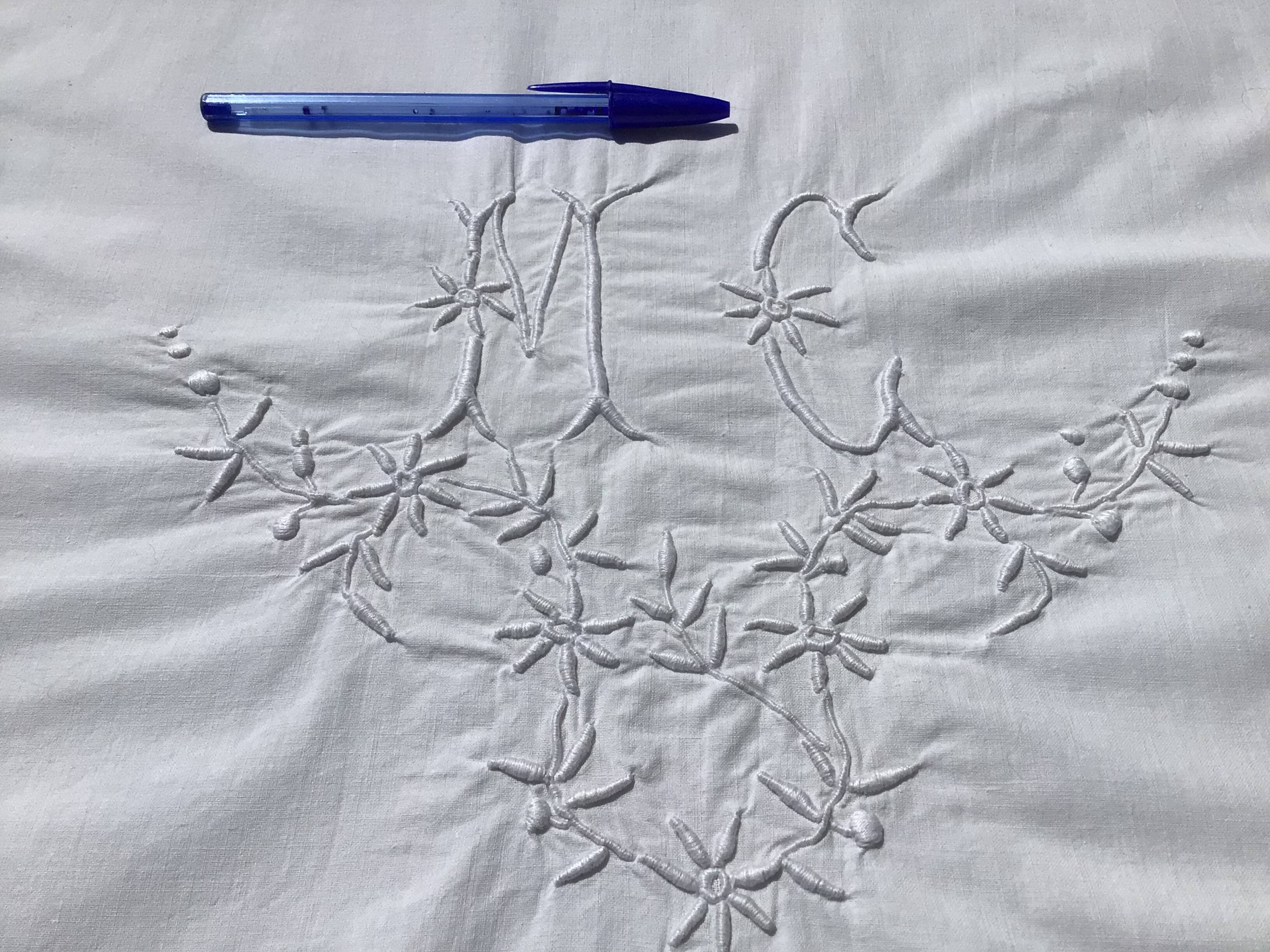 MC embroidered pillowcase with flower detailing and crocheted edge