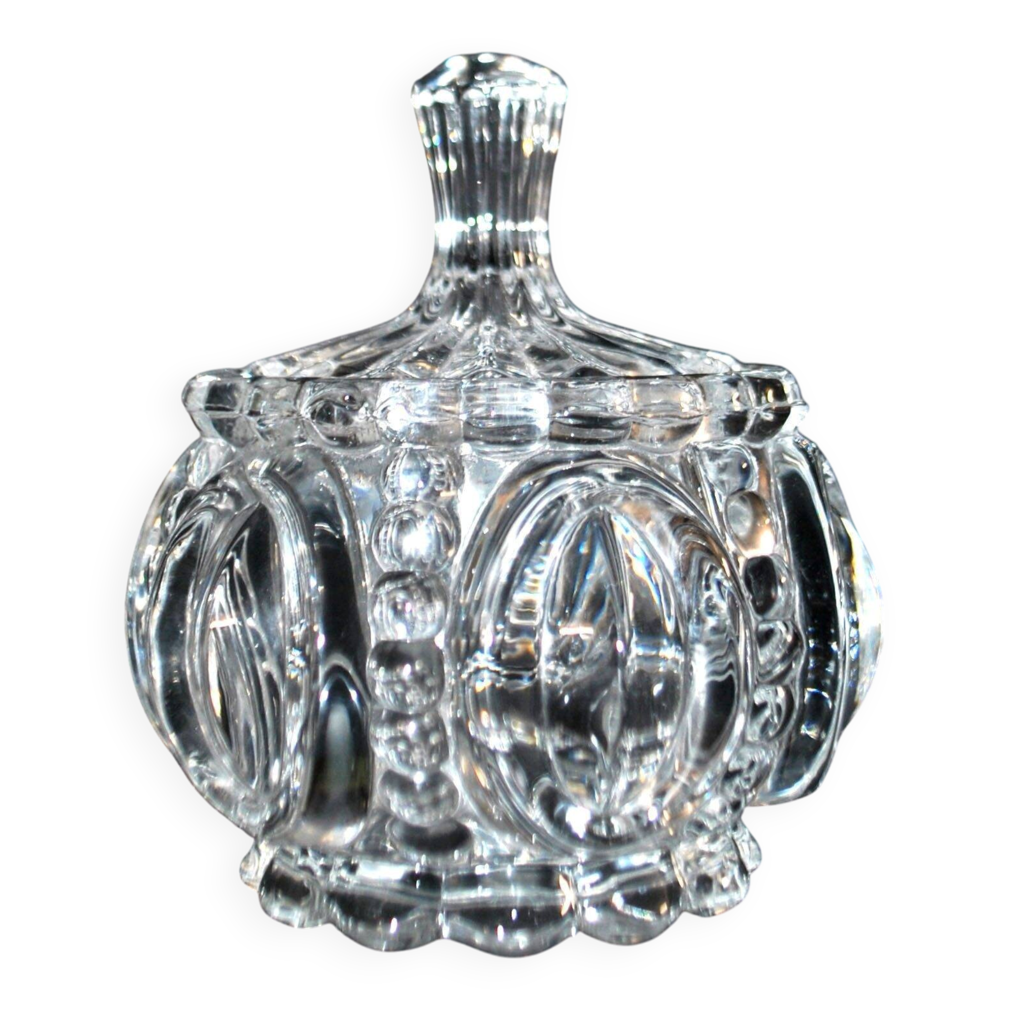 Thick moulded crystal sugar bowl with a beaded and medallion design.