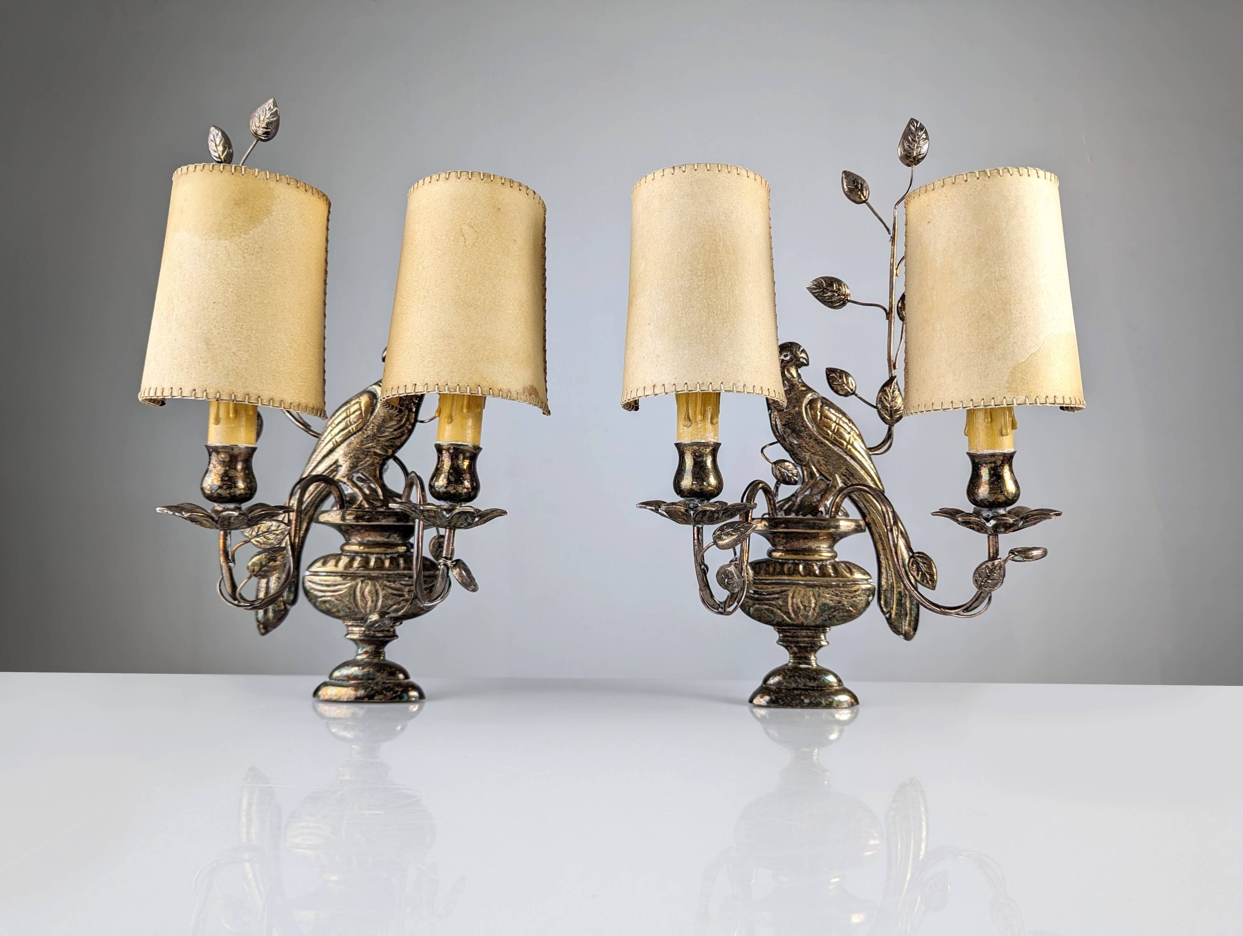 Pair of wall sconces with parrots and leaves
