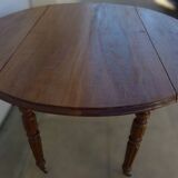Antique round table with shutters in walnut wood on casters