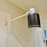 Pair of long white arm wall lights with black spot. "lita device"