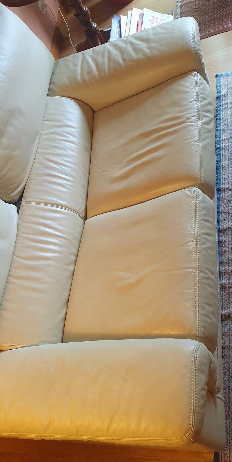 Two-seater convertible sofa bed in off-white leather by Ligne Roset.