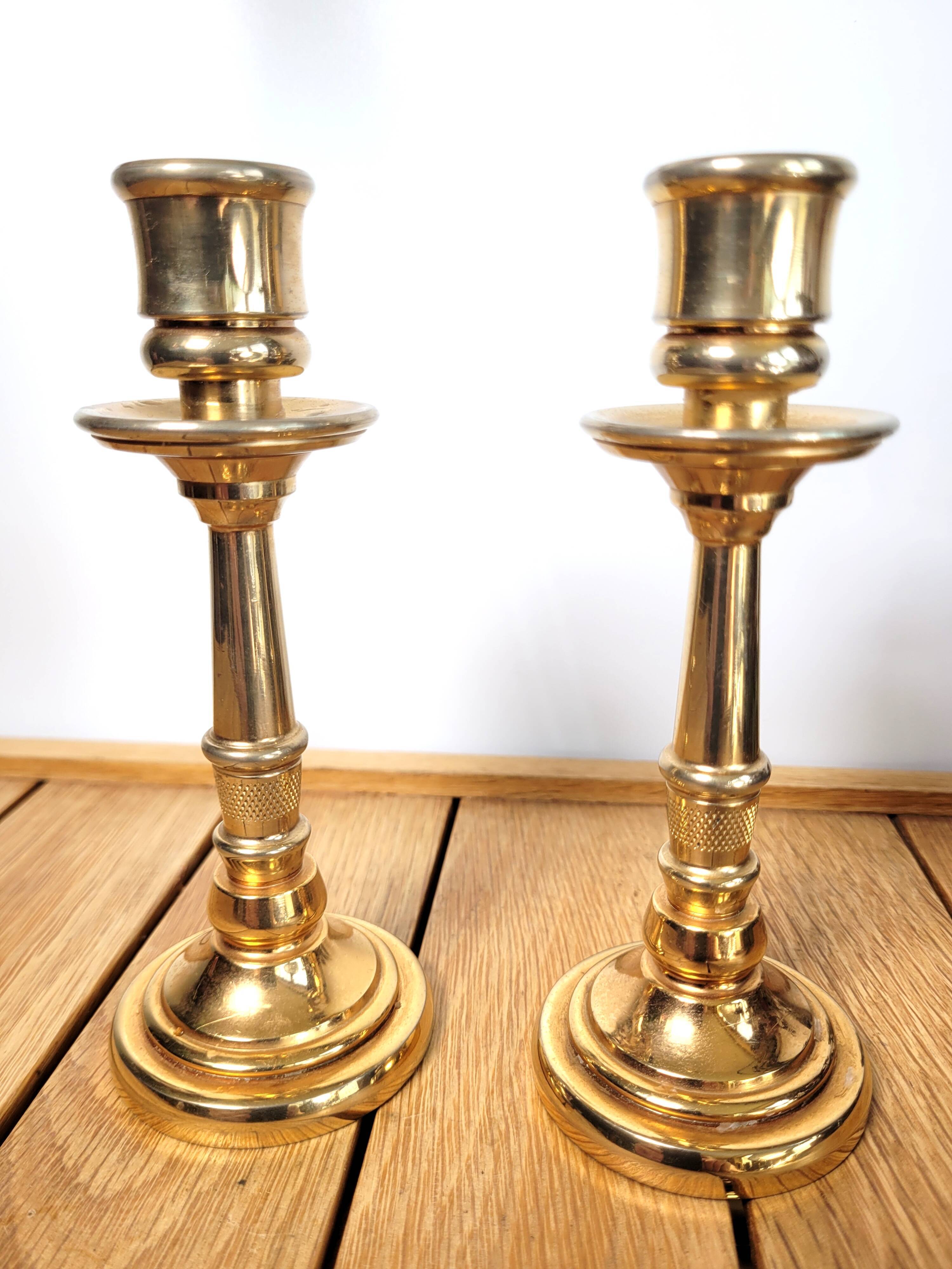 Pair of candle holders in solid gilded metal
