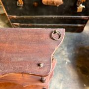Curved and turned wooden wall shelf