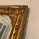 Nineteenth century mirror in wood and stucco gilded with rich gold leaf ornamentation, 101x127 cm