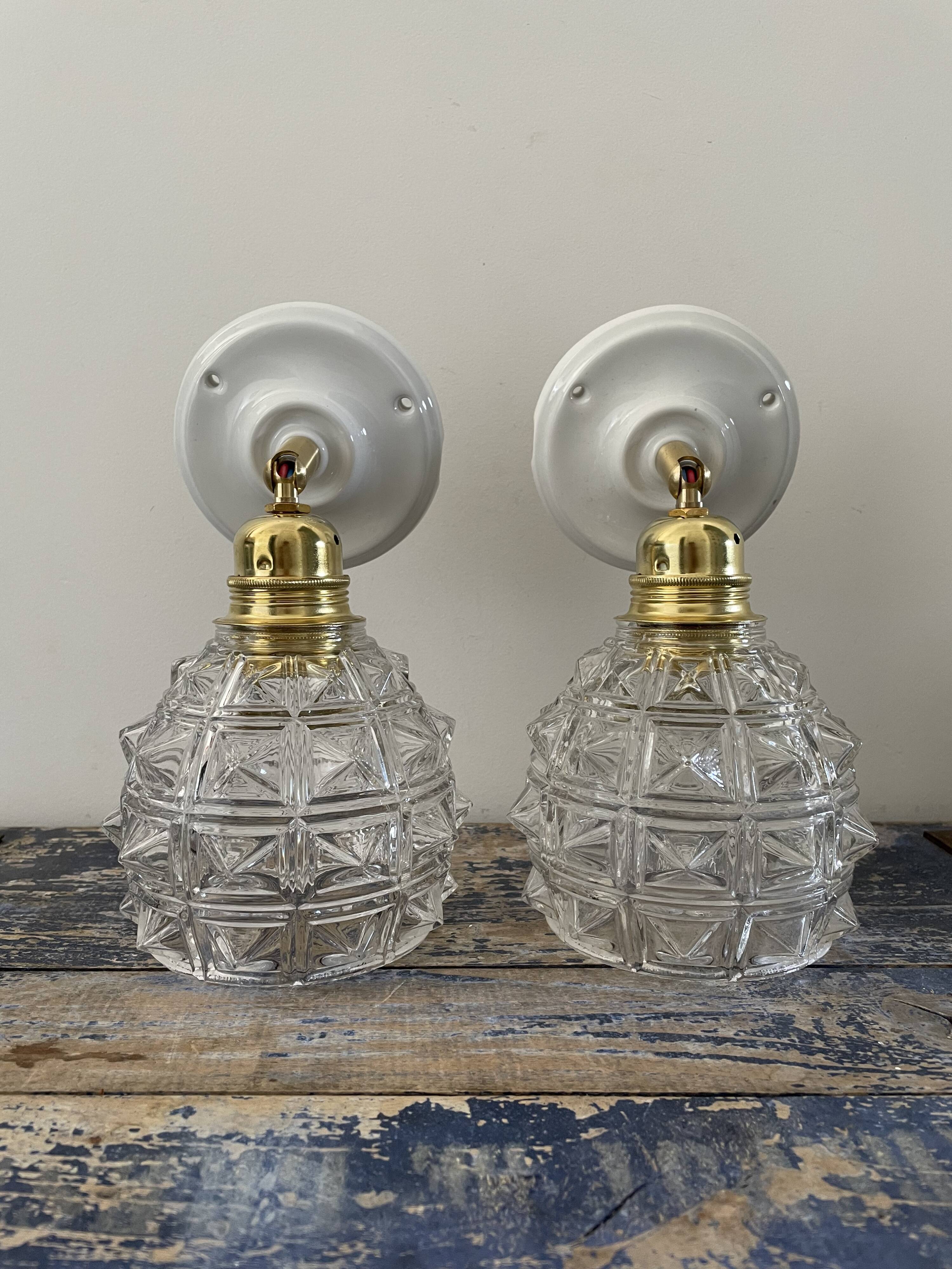 Pair of new electrified chiseled glass sconces
