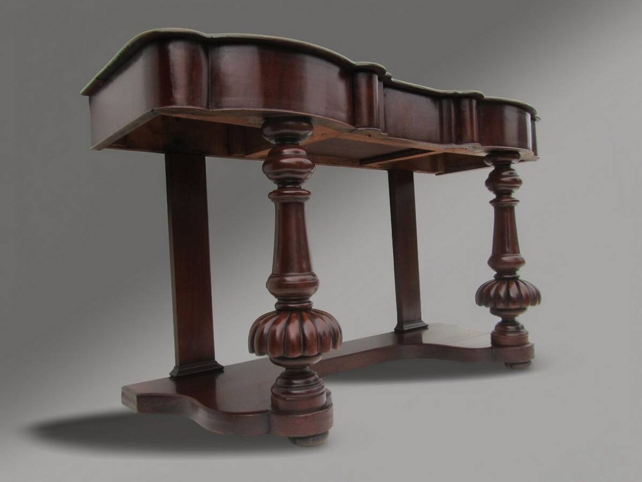 Mahogany and green leather console, 1860-70