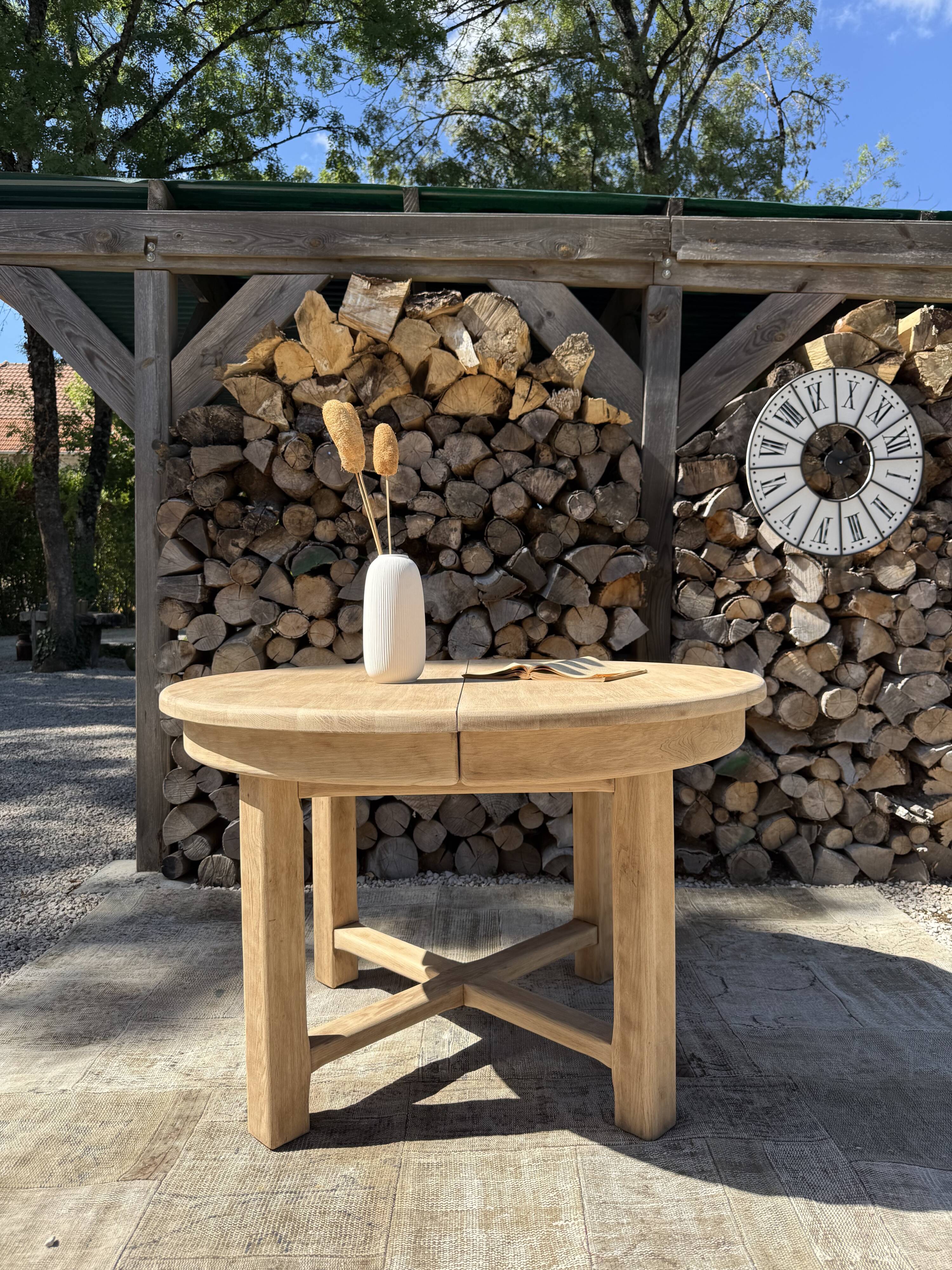 Round solid oak table with extensions, maximum 220cm.