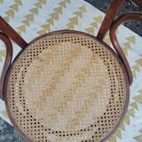 Caned chair with armrests attributed to Fischel