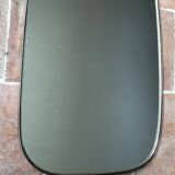 Vintage 1960 free-form mirror known as a retro mirror with a gold and black metal trim.