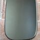 Vintage 1960 free-form mirror known as a retro mirror with a gold and black metal trim.