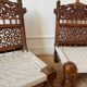 Pair of traditional Indian chairs made of carved wood and rope