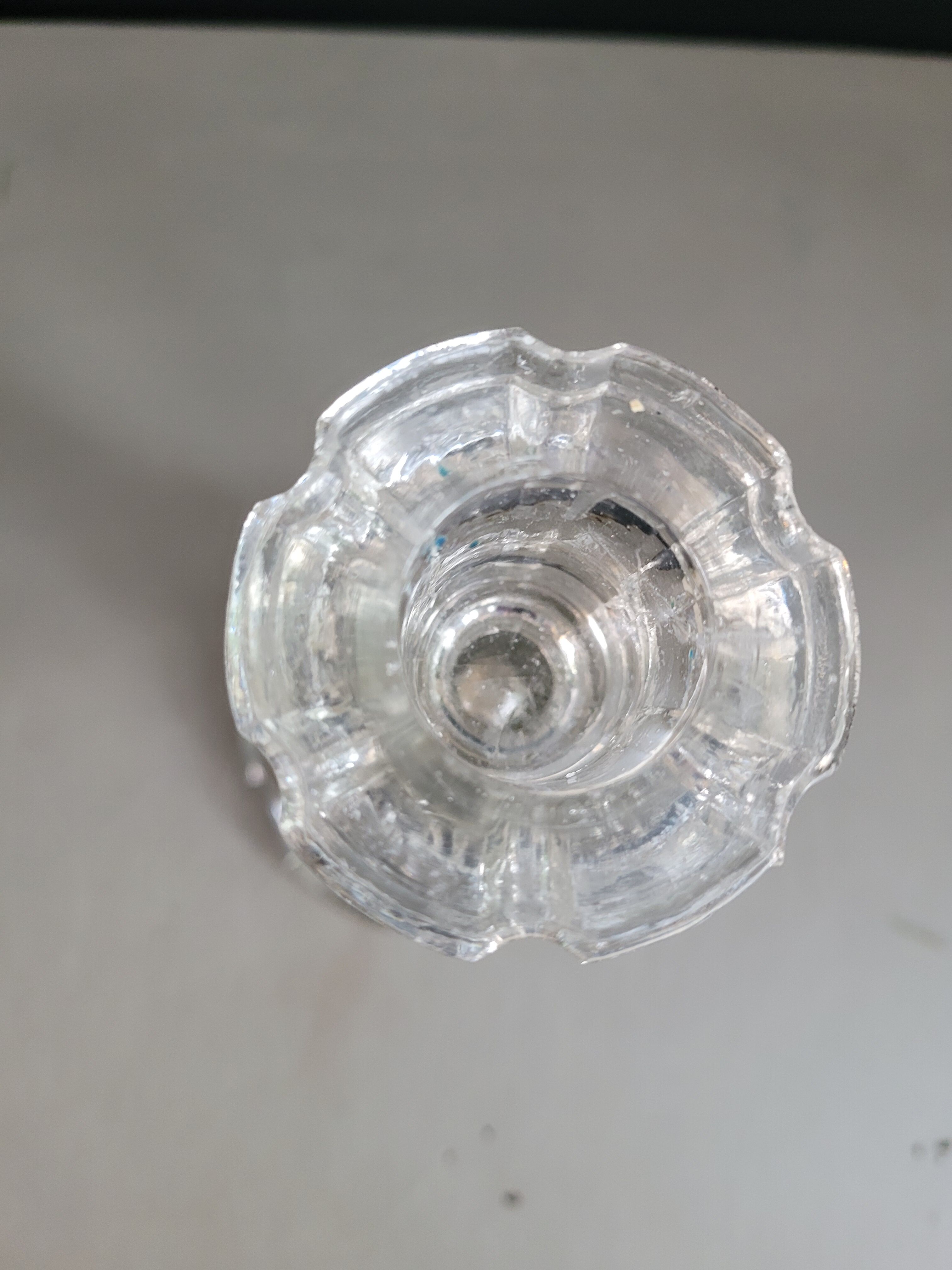 Old candlestick with molded glass stamps
