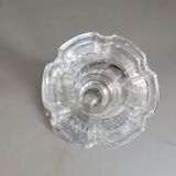 Old candlestick with molded glass stamps